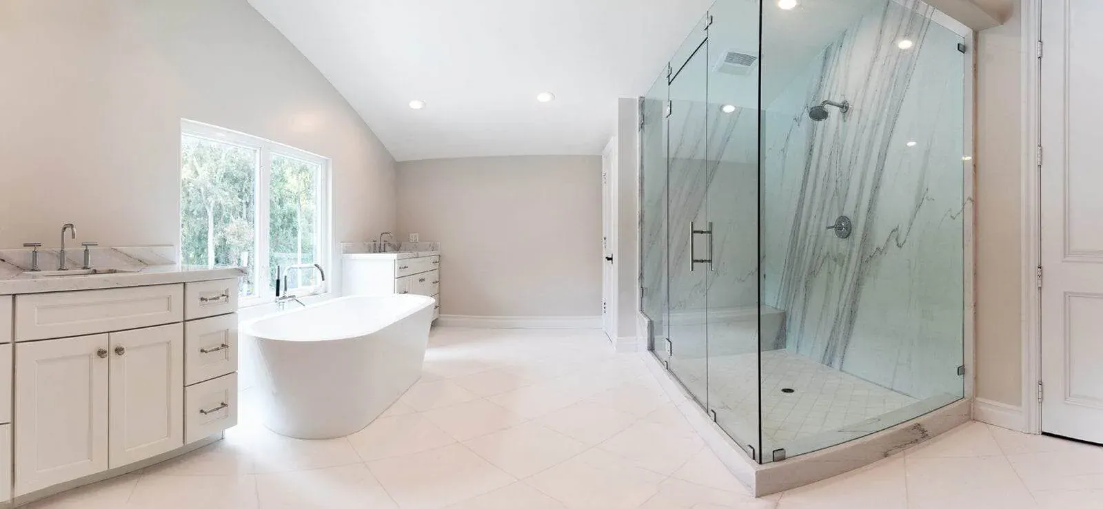Remodeled bathroom featuring a walk-in tiled shower and a floating timber vanity