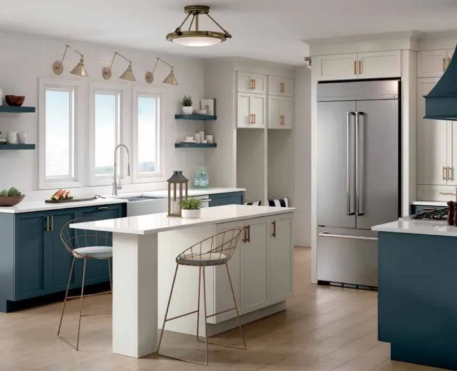 Navy blue lower cabinets with white countertops, open wall shelving and a stainless steel built-in refrigerator