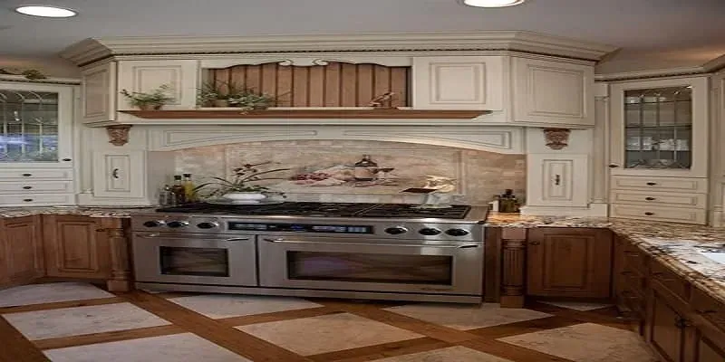 Kitchen floor of stone tiles set in a grid of inlaid wood strips in front of a stainless range