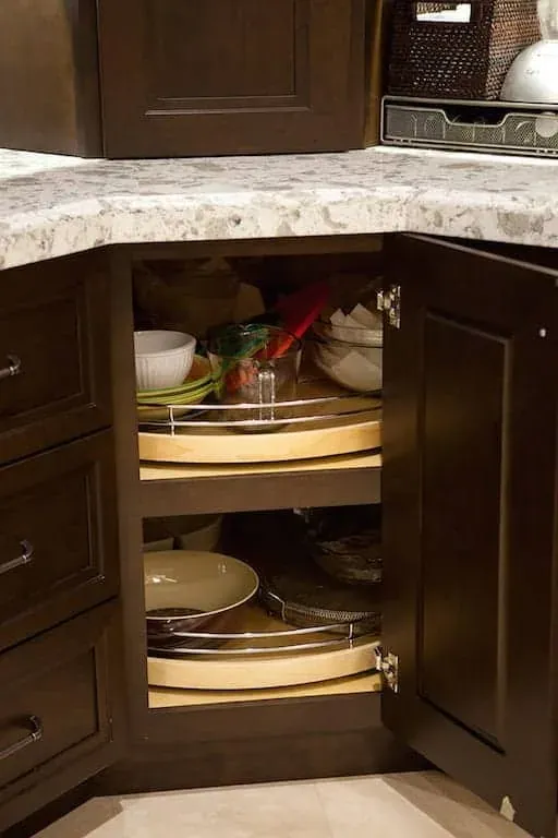 Open corner cabinet with a rotating carousel shelf