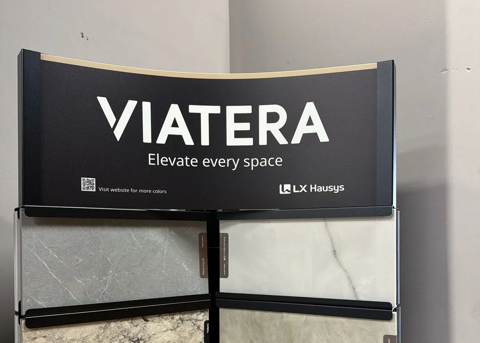 Viatera by LX Hausys corner display in the Anaheim showroom holding grey, white and gold veined surface samples